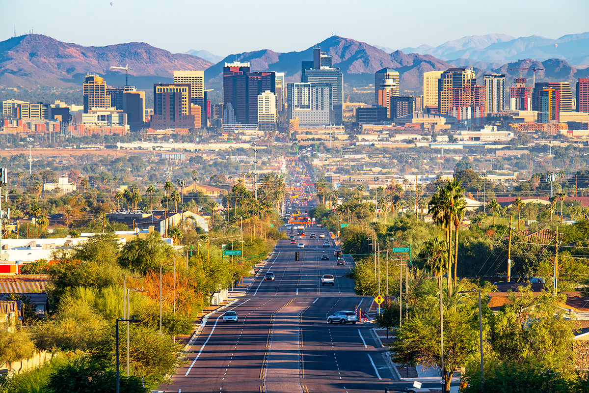 Phoenix, Arizona skyline with mountains behind it.