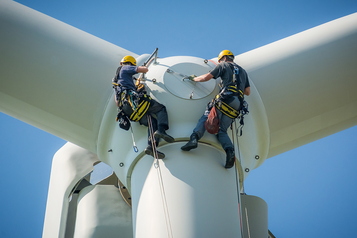 Climate Jobs - Workers repairing a wind turbine